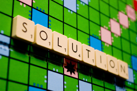 This is an image of a word puzzle board game with the word solution spelled out for points.