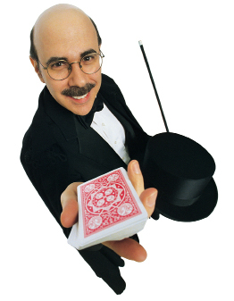 This is a photo of a magician holding a deck of cards.
