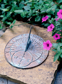 This photo shows a sundial on a pedestal.