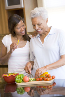 This shows a photo of a mother and daughter preparing a meal together.
