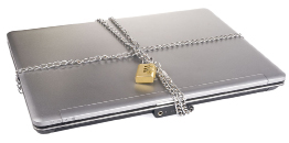 This shows a photo of a laptop computer chained shut and locked down.