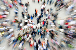 This shows a photo of a crowd on a busy street.