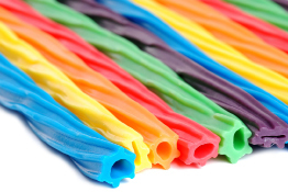 This shows a photo of several sticks of fruit-flavoured licorice.