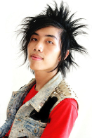 This shows a photo of a young man with spiky hair.