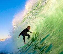 This is a photograph of a surfer riding a wave.