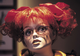 This shows a close-up photo of a toy fashion doll. 