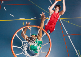 This shows a photo of a man about to shoot a basketball over a defender.