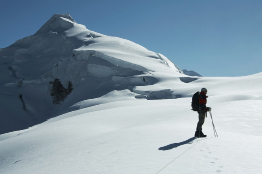 This shows a photo of a mountain climber ascending the Ishinca peak.