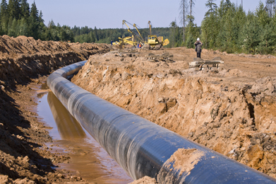 This is a photo showing a pipeline being built in a trench.