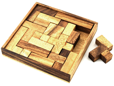 This is a photo of a wooden puzzle with a piece left on the side.