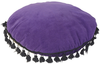 This is a photo of a circular purple pillow.