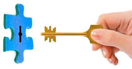This is a photo of a key entering a puzzle piece.