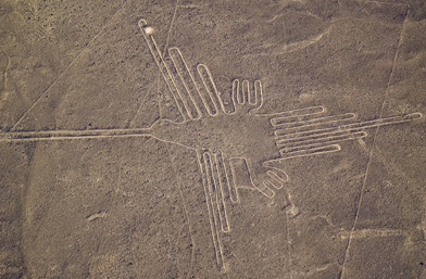 This is a photo of the hummingbird geoglyph in the Nazca lines in Peru.