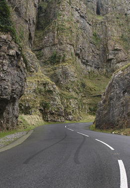 This photo shows tire skid marks on a mountain road.