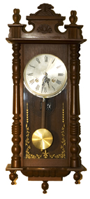This photo shows a pendulum wall clock.
