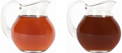 This is a photo of two pitchers of iced tea. There is the same amount of iced tea in each pitcher, but the iced tea in one of the pitchers is darker in colour than the other.