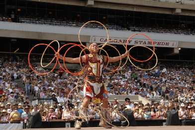 This photograph shows a First Nations hoop dancer.