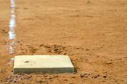 These photos show a baseball diamond and a close up of one of the bases.