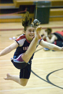 In this photograph a girl is competing in a two-foot high kick competition.
