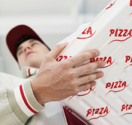 This photo shows a person delivering pizza.