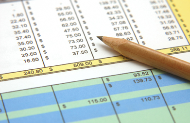 This shows an image of a pencil on a spreadsheet.
