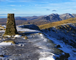 This is a photo of a trig point at Old Man of Coniston in England.