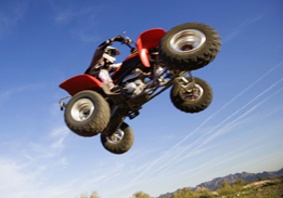 This is a photo of a quad flying through the air.