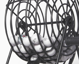 This photo shows a bingo cage containing several marked bingo balls.