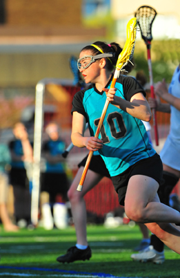 This shows a photo of a female lacrosse player.