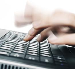 This is a photo of fingers typing on a keyboard.