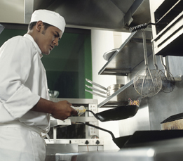 This is a photo of a cook preparing food.