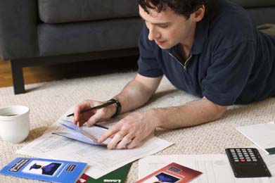 This photo is of a  man reviewing his finances.