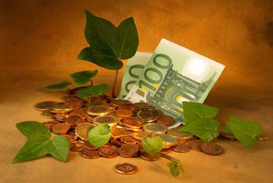 In this photo, vines appear to be growing from coins and bills.
