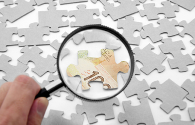 In this photo, money is a piece of the puzzle.