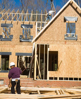 In this photo, workers are building a house.
