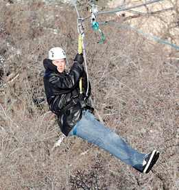 This is a photo of a person on a zip line.