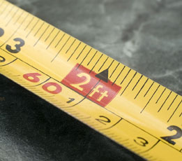 This image shows a measuring tape near the two feet or 61 centimetre point.