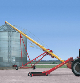 This is a photo of a grain auger by a grain bin.
