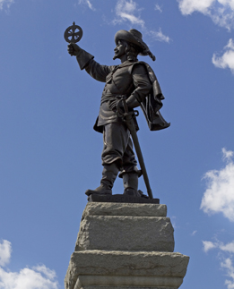 This is a photo of a statue of Samuel de Champlain holding an astrolabe at Nepean Point in Ottawa.