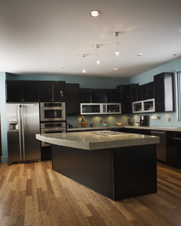 This is a photo of a modern kitchen with an island counter.