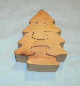 This is a photo of a child’s wooden puzzle of a Christmas tree.