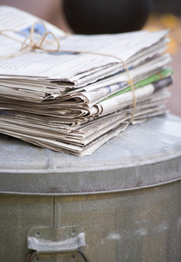 This is a photo of newspapers bundled for recycling.
