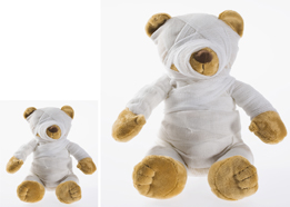 This is two photos of teddy bears wrapped in bandages. One teddy bear is large, and one is small.