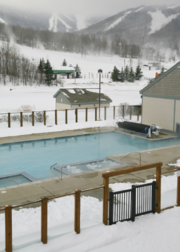This winter photo is of an outdoor swimming pool at a hot springs resort.