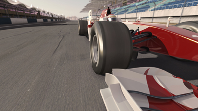This  photo shows a Formula 1 race car as it is being driven along a track.
