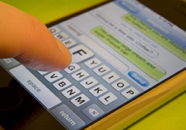 This photo shows a person texting on a phone.