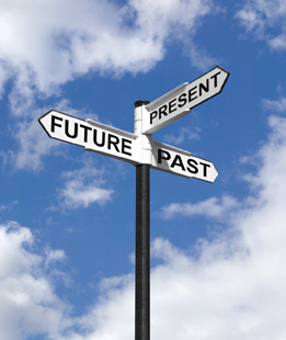 This photograph shows a street sign showing Future, Past, and Present directions.