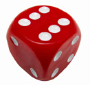 This photograph shows a red die with the number six facing up.