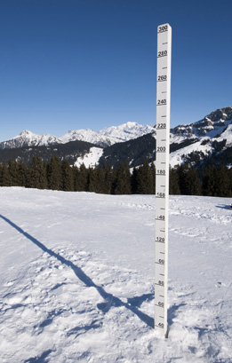 This photograph shows a measurement of snowfall in the mountains.