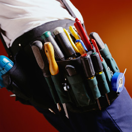 This is a photo of a person wearing a tool belt full of tools.